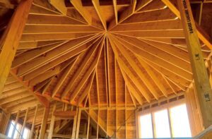 A wooden ceiling in the middle of construction.